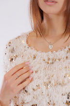 Maglia piume e paillettes