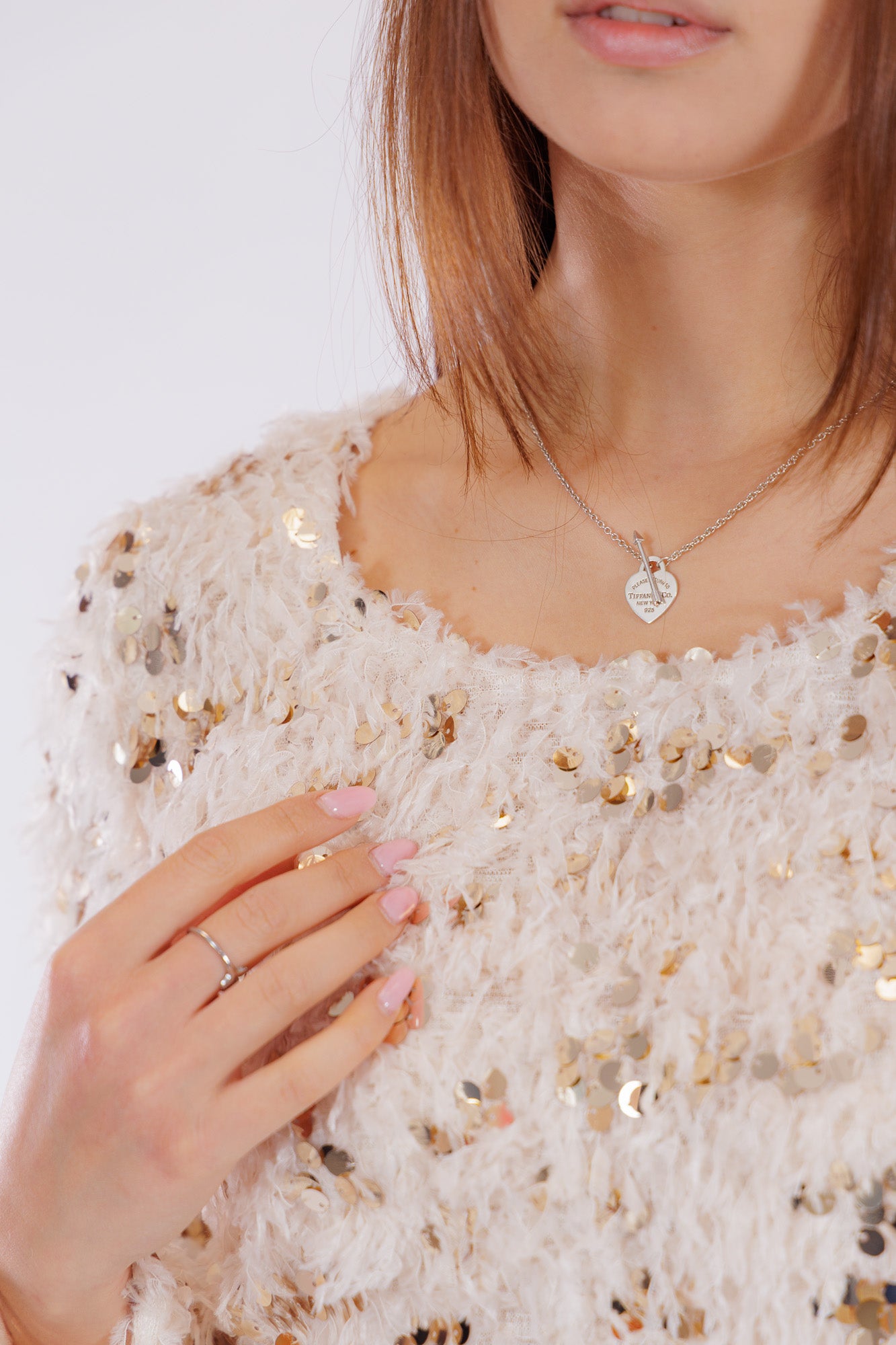 Maglia piume e paillettes