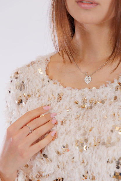Maglia piume e paillettes