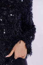 Maglia piume e paillettes