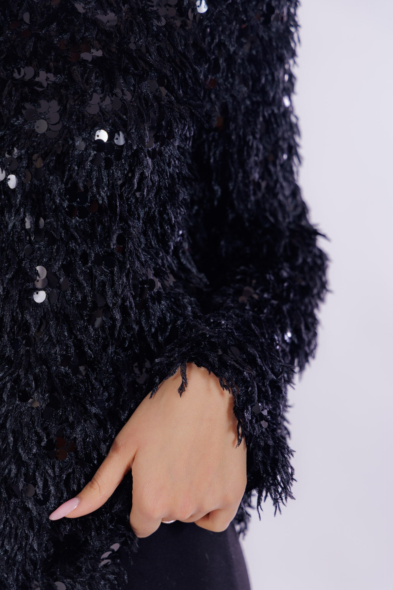 Maglia piume e paillettes