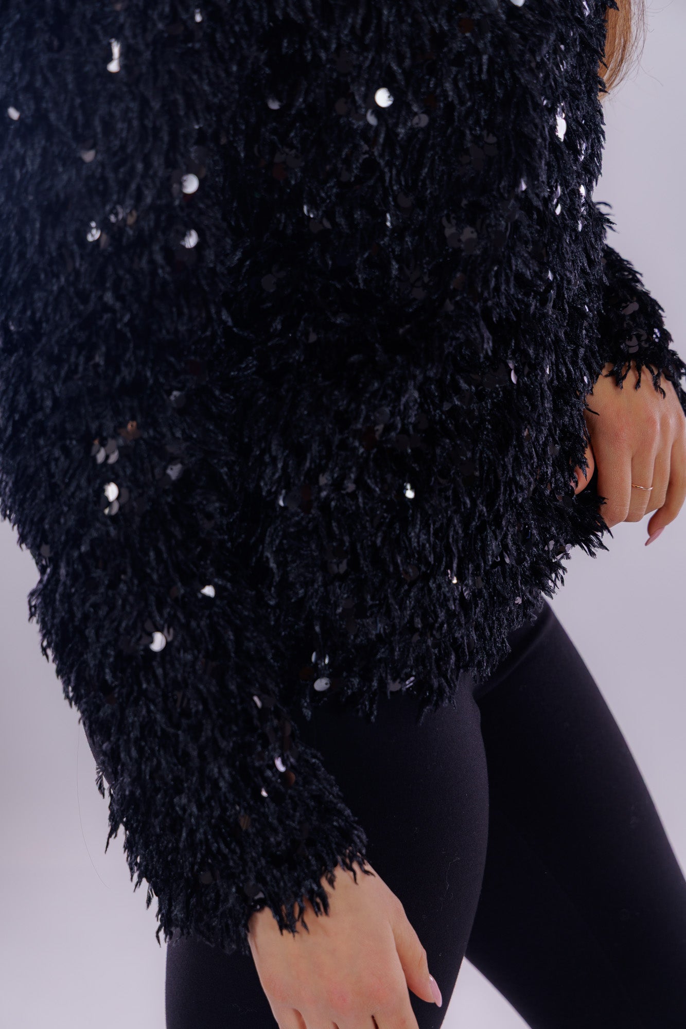 Maglia piume e paillettes