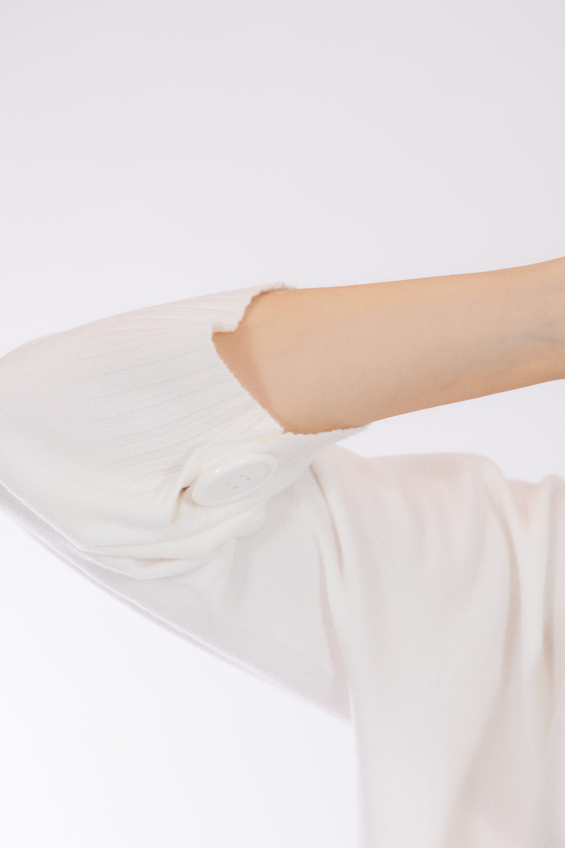 Maglia crop manica bottone