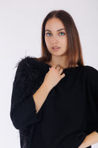 Maglia piume sul lato