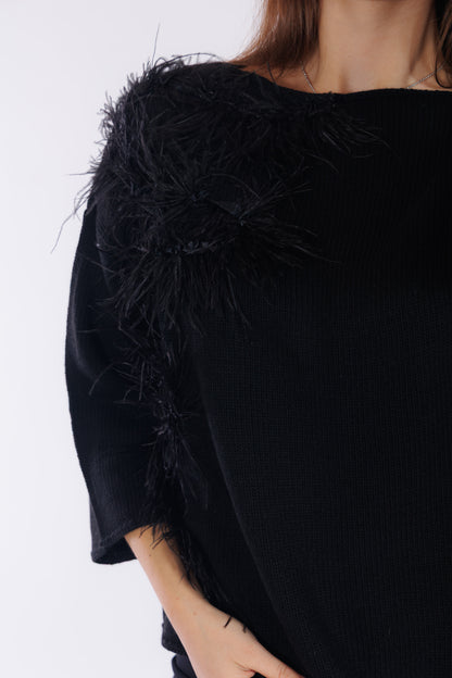 Maglia piume sul lato