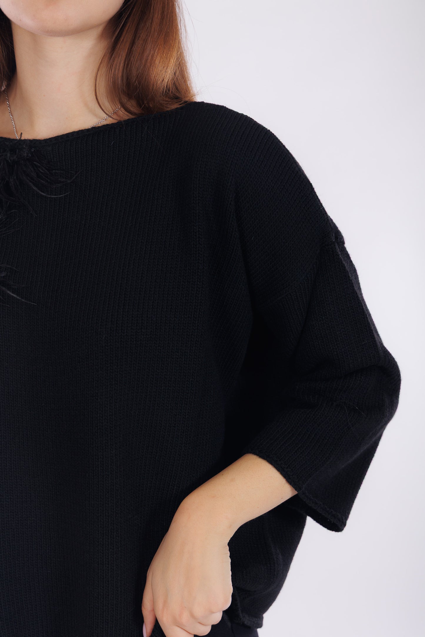 Maglia piume sul lato