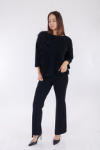 Maglia piume sul lato