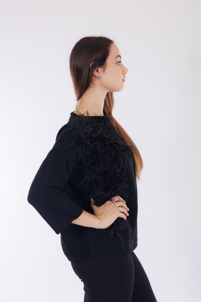 Maglia piume sul lato