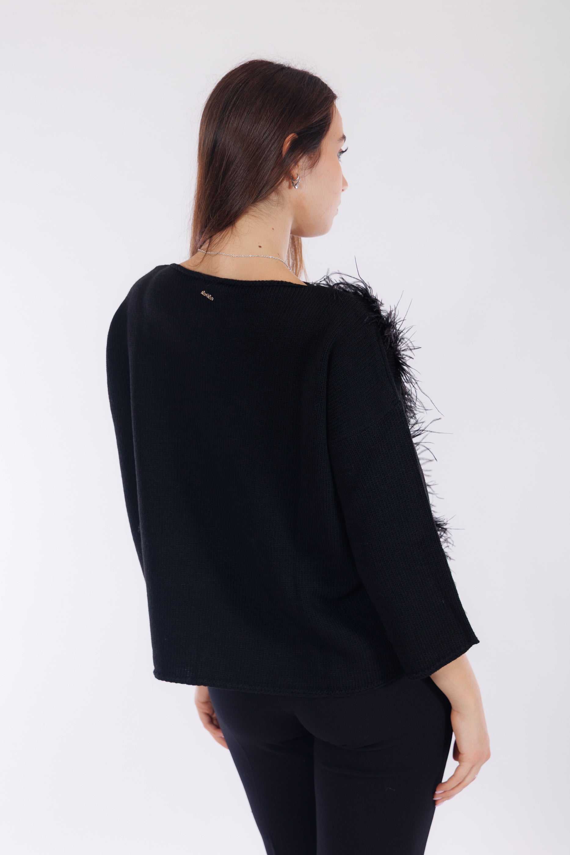 Maglia piume sul lato