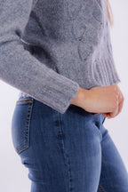 Maglia collo alto e trecce