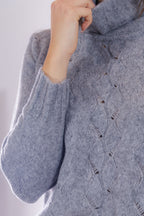 Maglia collo alto e trecce