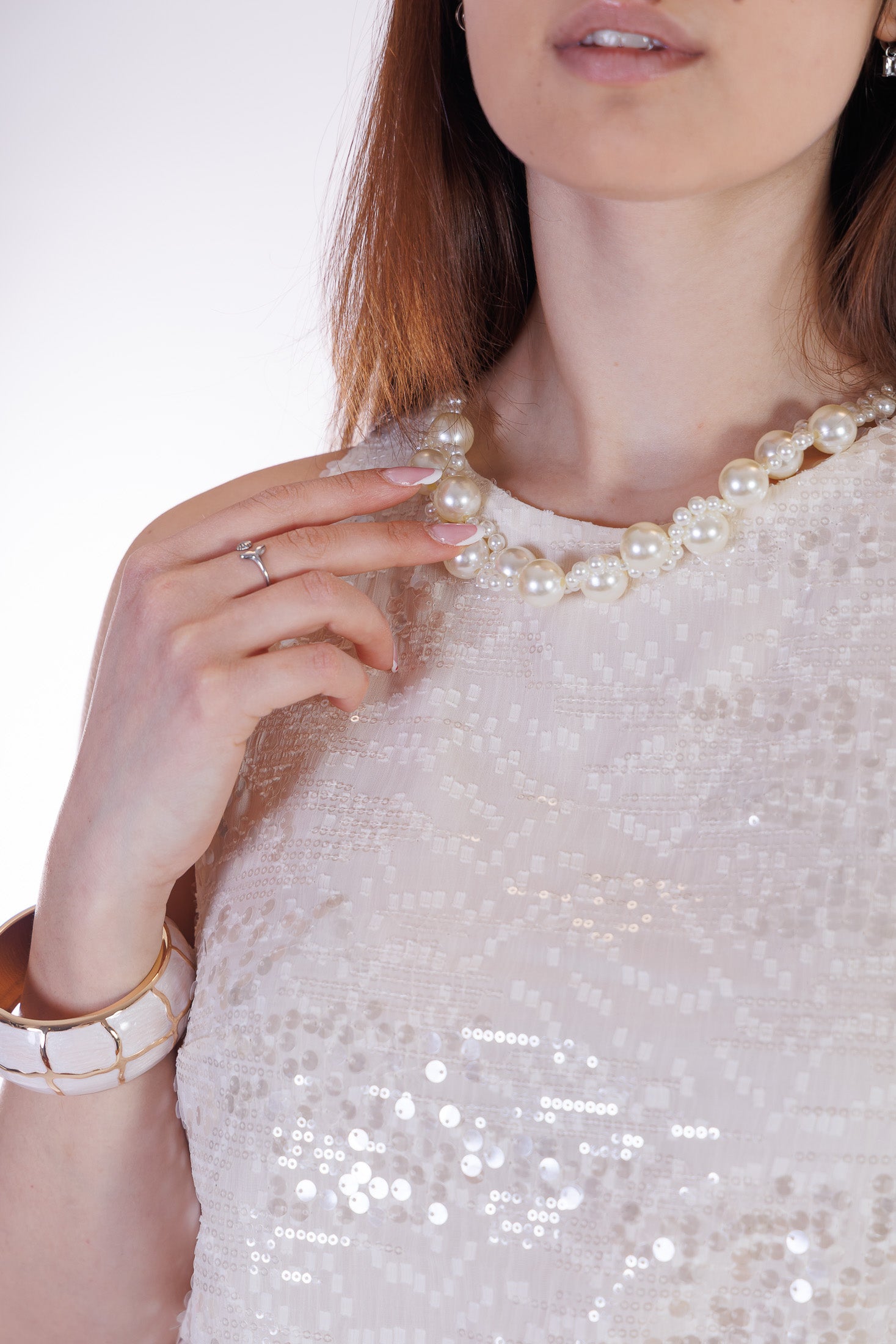 Top collana e paillettes