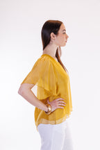 Blusa maniche farfalla